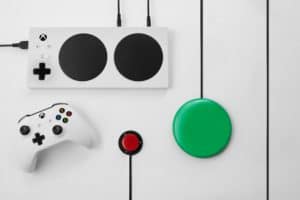 XAC controller with regular xbox controller and green and red adaptive gaming button switches attached