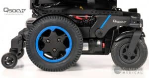 Shows drive wheels of Quickie's hybrid drive wheelchair the Q500 H