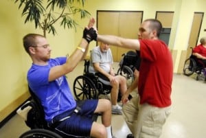 A self-defense instructor teaches techniques to Shepherd Center inpatients during a June 2015 class.