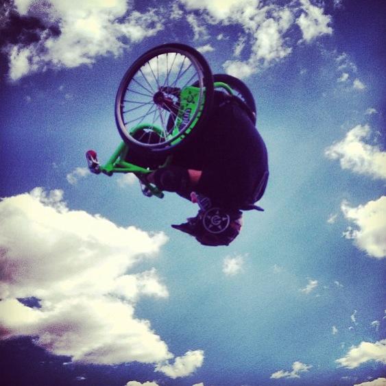 WCMX rider upside down in air