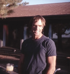 1979: Catching rays from his standing frame on his mountain home deck.