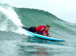 Brock Johnson competes in the Prone Assist division of the 2018 USA Adaptive Surfing Championships at the Harbor Jetty break, Oceanside, California.
