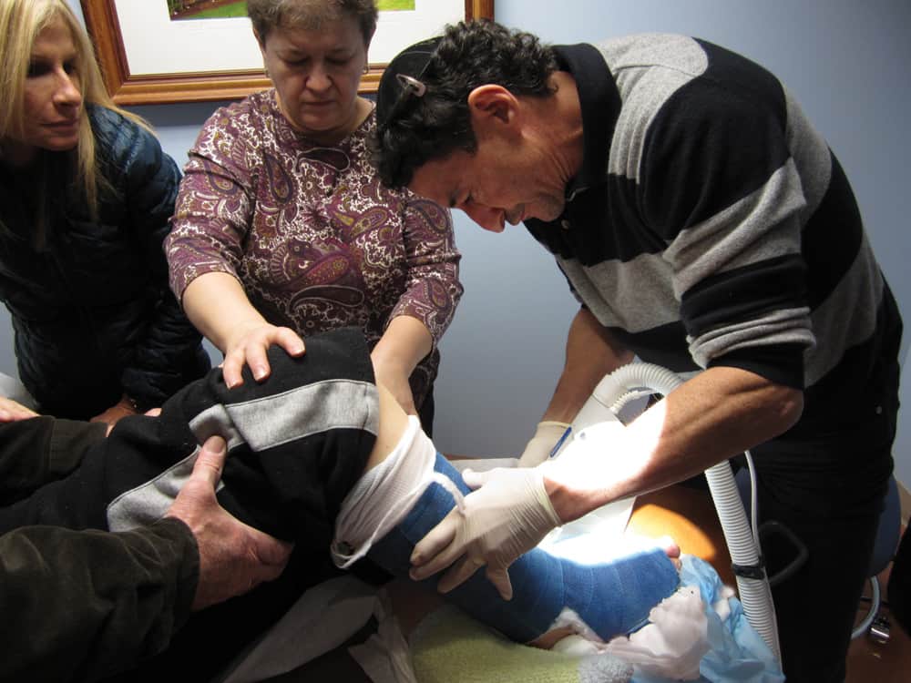 Dr. Bruce Ruben working on a patient.