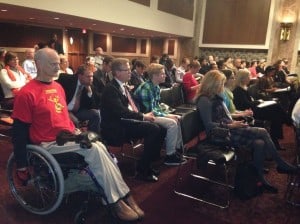 Maryland ADAPT organizer Crosby King watches the CRPD hearings.