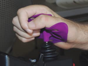 Joe Olson couldn’t get his old joystick knob to fit on his new power chair, so he engineered a better, ergonomic joystick. www.ergojoystick.com