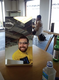 The author has explored Google Glass for about a month, but the photo on the right is his first selfie, taken at the Glass Basecamp in San Francisco.