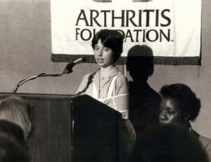 A young Heidi Johnson-Wright inspires potential donors with pitiful tales about the miseries of growing up with juvenile arthritis.