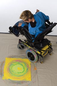 Tommy says painting with his wheelchair is like dancing.