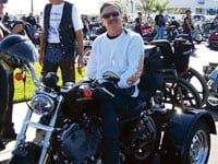 Hog riding is one of the activities Ron Devine can't do since his heated car seat burned him.