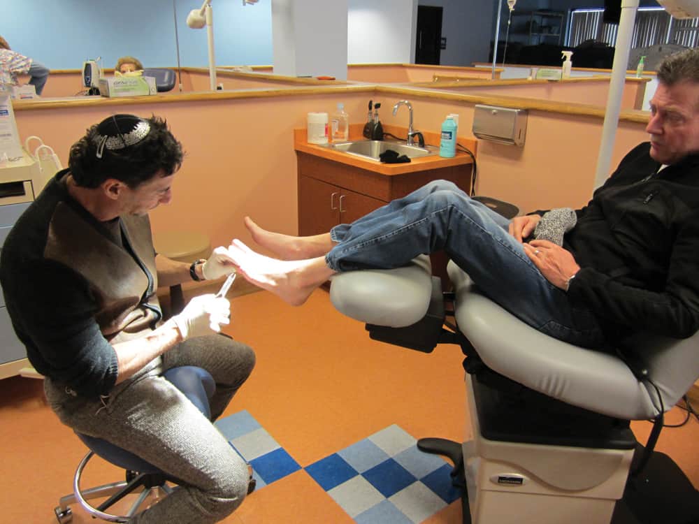 Dr. Bruce Ruben working on a patient.