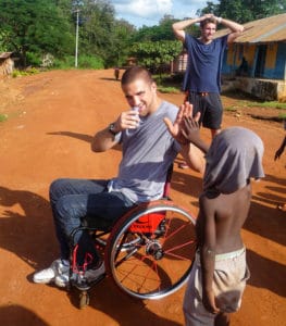 Jake Robinson trekked through a village in Ghana, where he met this young man giving him a high-five.