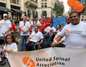 Weisman marches with the United Spinal crew at a New York City Disability Pride march.