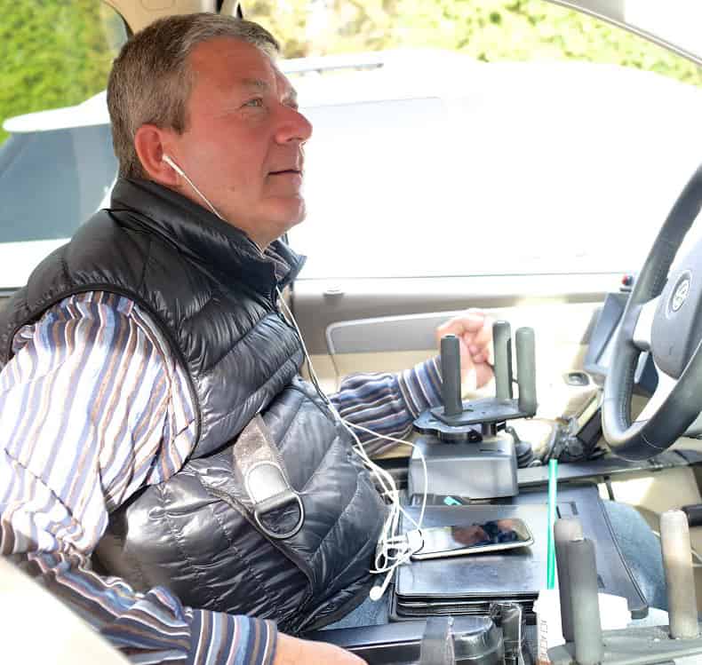 Luigi Girotto drives for Uber with quad hand controls.