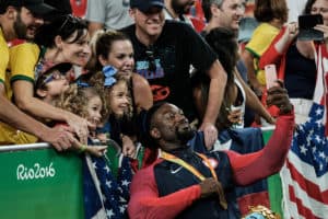 USA’s Matt Scott celebrates with fans after receiving a gold medal in men’s wheelchair basketball at the Rio 2016 Paralympic Games in Rio de Janeiro on September 17, 2016.
