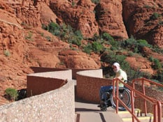 A modern ramp appears to wind into Sedona’s timeless red rocks.