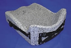 View of a "naked" Ride custom cushion showing beaded construction and integrated Contour Adjustment Mechanism.