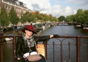 Davis poses in Amsterdam, where she landed an accessible place to stay through a home swap. Her next move? A website facilitating such swaps!