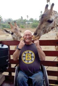 United Spinal member Rick Hayden enjoys the giraffes at the San Diego Zoo Safari Park.