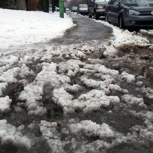 Snow covered curb cut