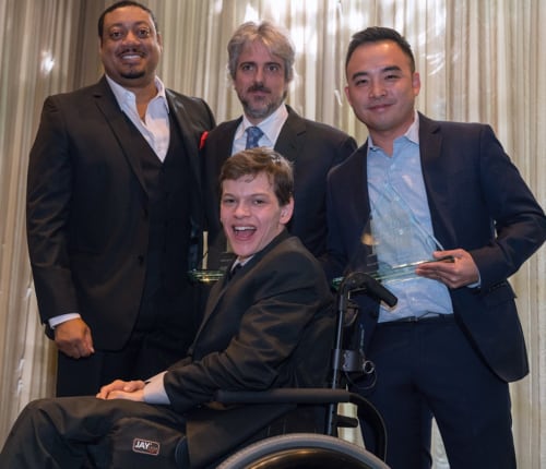 Speechless’ Cedric Yarbrough, Scott Silveri, Melvin Mar and Micah Fowler pose with one of three awards the show won at this year’s Media Access Awards. Photo by Michael Hansel.