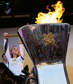 Bristol Paralympic sailor Blaire Hannan lights the Olympic cauldron in the Bristol amphitheater in May in front of thousands of cheering Bristolians.