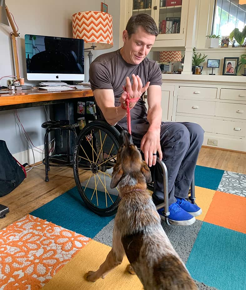 A quad-friendly tug toy works out man and dog.