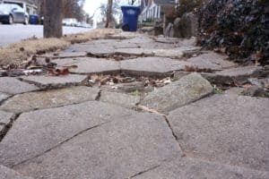 cracked and broken, sidewalk access is difficult for wheelchair users