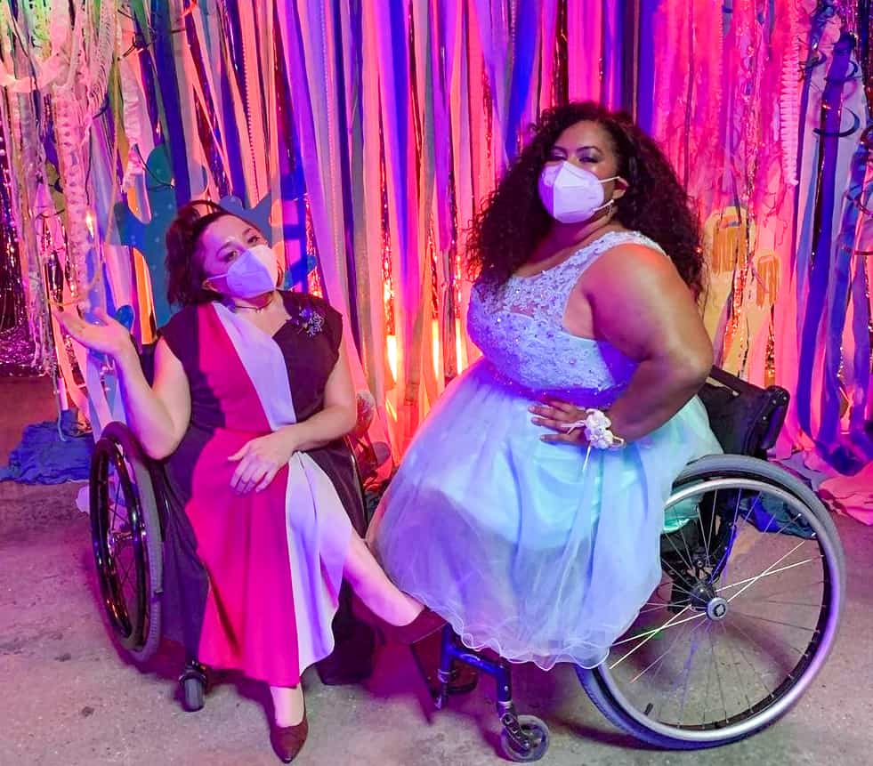 Nicole Lynn Evans and Danielle Perez pose in their
masks between takes.