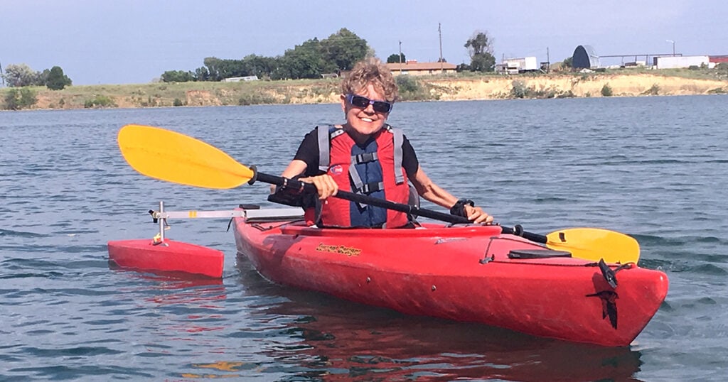 Terri Wickstrom riding a kayak