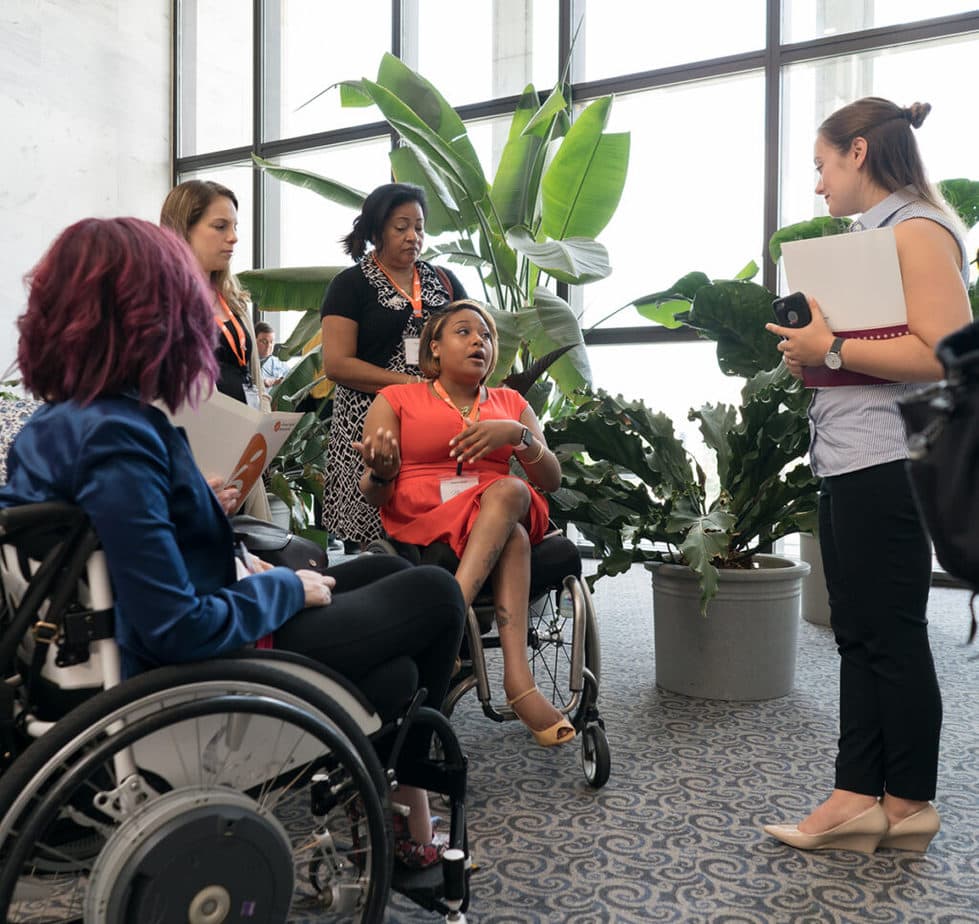 Advocate Andrea Dalzell speaks to a
staff member of one of her representatives.