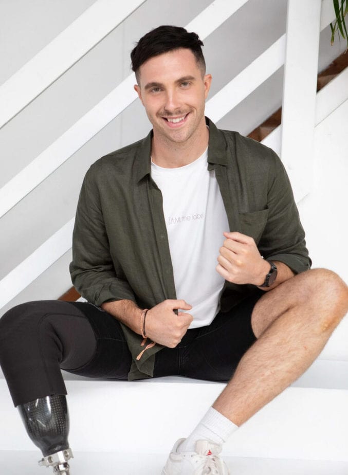 man with prosthetic modeling magnetic closing shirt