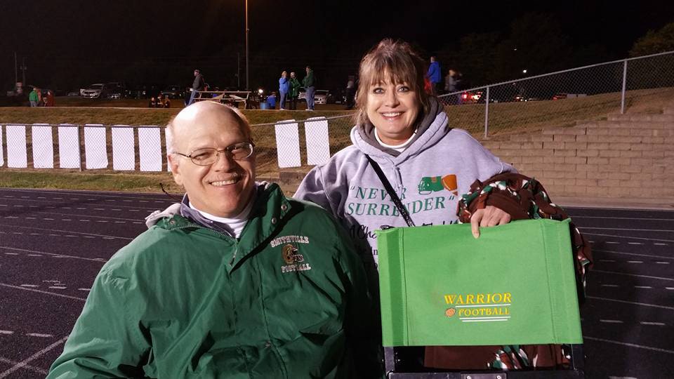 man and woman at a football game
