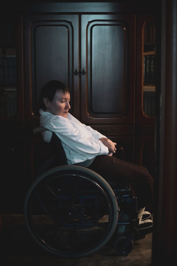 full sideview of Oksana sitting in wheelchair