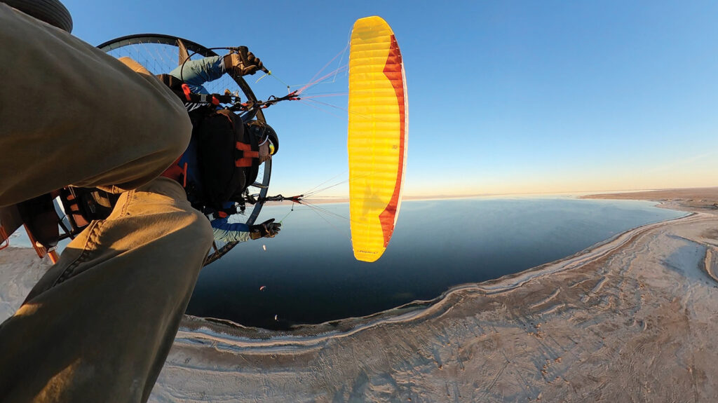 paraglider wat up in the sky with the Great Salt Lake below