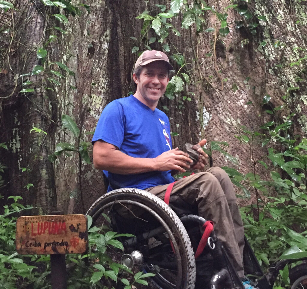 man in wheelchair in Amazon rainforest