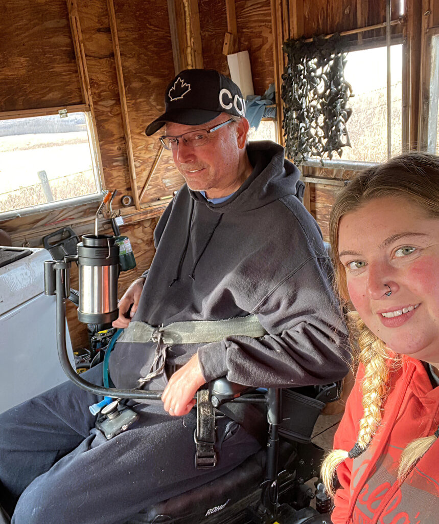the author with daughter in hunting shack