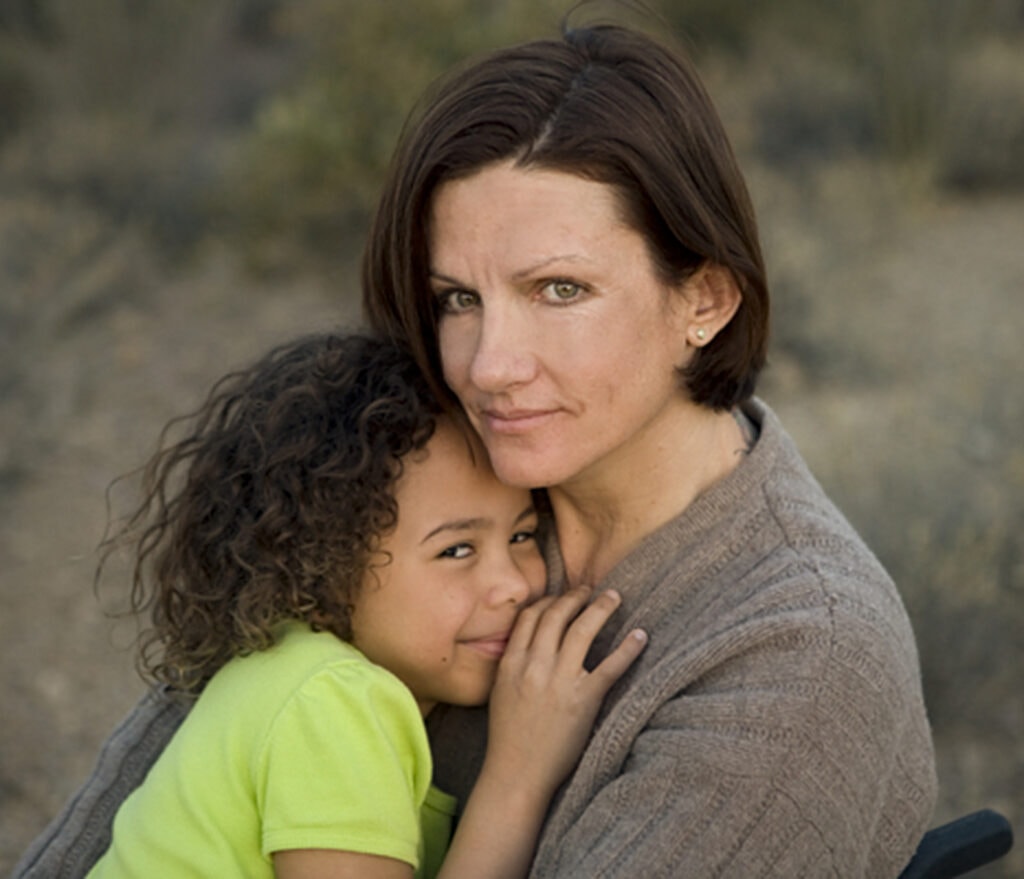 woman hugging her young daughter in az