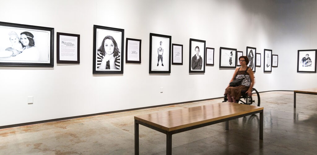 woman in wheelchair in art gallery