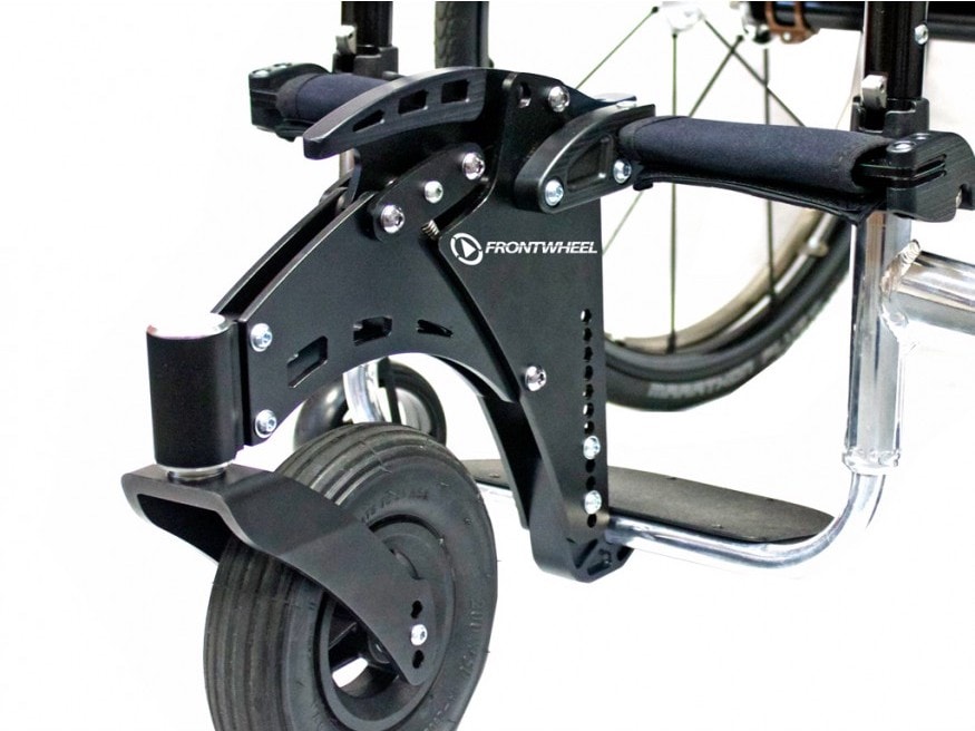 Large front caster wheel attached to chrome wheelchair frame.