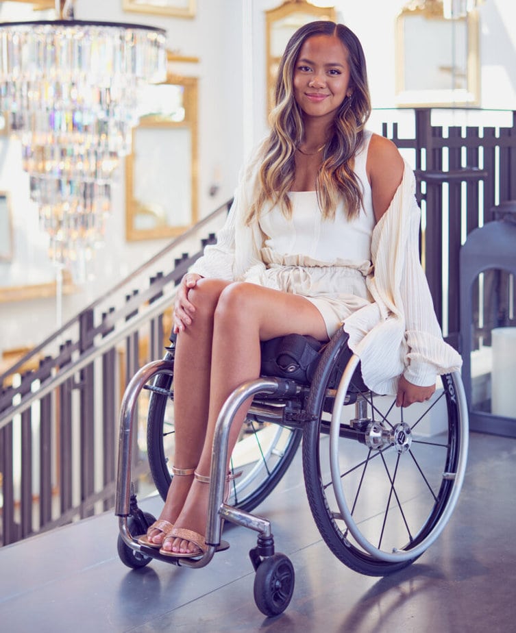 woman in wheelchair smiling for camera