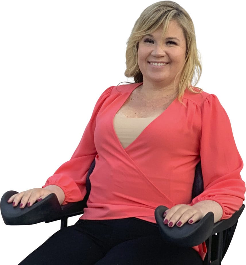 woman in wheelchair smiling for camera