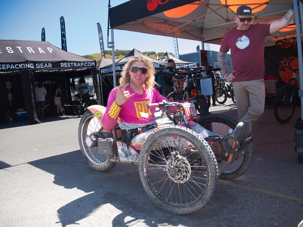 man on mountain bike smiling for camera
