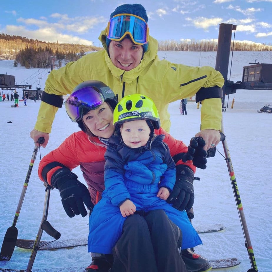 Man, woman and child posed on the slopes