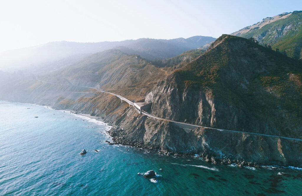 aerial view of PCH going thru mountains