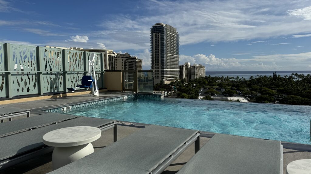 a rooftop infinity pool in a city. 