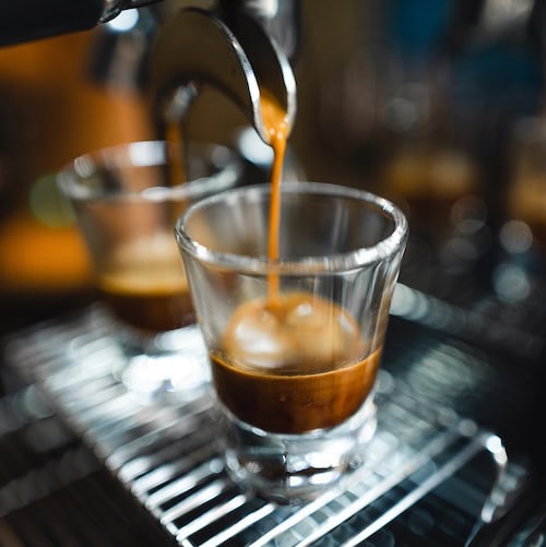 espresso being poured into a glass