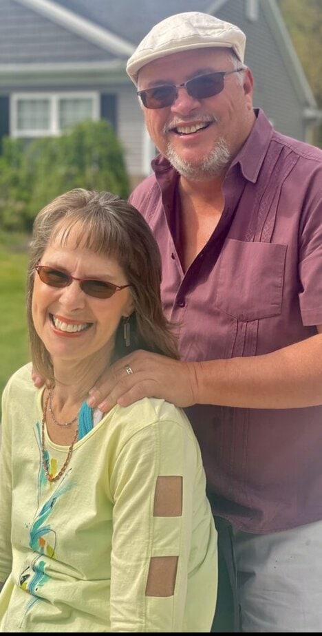 Happy couple enjoying outdoor solar mobility solutions and eco-friendly transportation options.