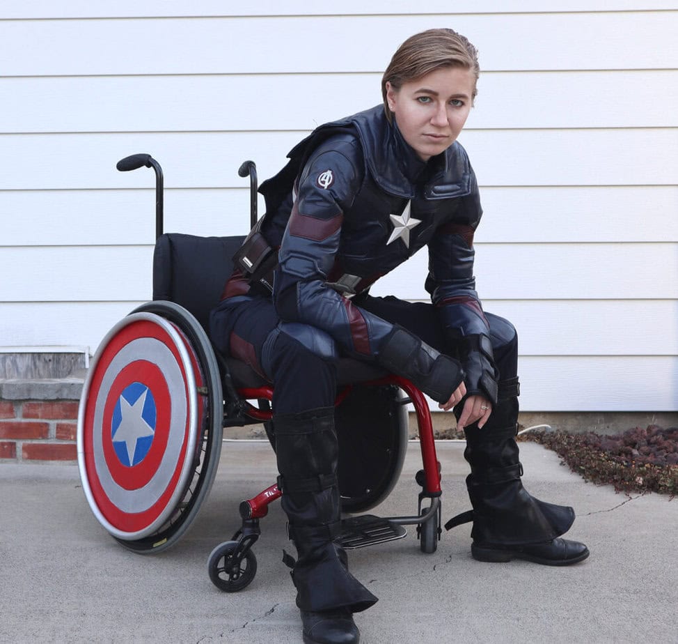 woman using wheelchair in captain america costume.