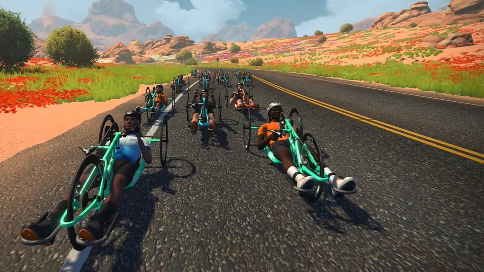 computer generated image of handcyclists riding on a road.
